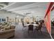 Community clubhouse featuring multiple seating areas for gatherings and social events at 3750 Pinebrook Cir # 104, Bradenton, FL 34209