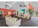 Bright common room features a piano, comfortable seating, and modern decor perfect for relaxing or entertaining at 3750 Pinebrook Cir # 104, Bradenton, FL 34209