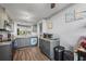 Open kitchen boasts gray cabinetry, stainless appliances, and wood-look vinyl floors at 3750 Pinebrook Cir # 104, Bradenton, FL 34209