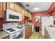 Functional community kitchen with modern appliances and ample counter space at 3750 Pinebrook Cir # 104, Bradenton, FL 34209