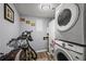 The laundry room has stacked washer and dryer and extra storage space at 3750 Pinebrook Cir # 104, Bradenton, FL 34209