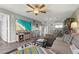 Comfortable living room has wood-look vinyl flooring and coastal decor throughout at 3750 Pinebrook Cir # 104, Bradenton, FL 34209