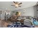 Living room shows furniture, including couch, chair, end table, and decorative rug at 3750 Pinebrook Cir # 104, Bradenton, FL 34209