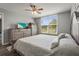 Spacious main bedroom offers large windows and neutral decor, plus vinyl floors at 3750 Pinebrook Cir # 104, Bradenton, FL 34209