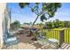 Outdoor grill area featuring picnic tables, seating, and well-maintained landscaping at 3750 Pinebrook Cir # 104, Bradenton, FL 34209