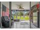 Enclosed patio with tile floor and ceiling fan with views of the golf course at 3750 Pinebrook Cir # 104, Bradenton, FL 34209