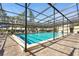 A view of the community pool with sun loungers and a clear, inviting swimming area at 3750 Pinebrook Cir # 104, Bradenton, FL 34209