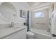 Clean bathroom featuring tub, vanity, mirror, and tiled wall and floor at 3806 Gulf Of Mexico Dr # C311, Longboat Key, FL 34228