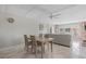 Bright dining area with comfortable seating and views of the living room at 3806 Gulf Of Mexico Dr # C311, Longboat Key, FL 34228