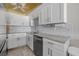 Modern kitchen with stainless steel appliances, marble counters, and updated cabinetry at 3806 Gulf Of Mexico Dr # C311, Longboat Key, FL 34228