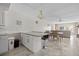 Open floor plan with kitchen island, dining area, and comfortable living space at 3806 Gulf Of Mexico Dr # C311, Longboat Key, FL 34228