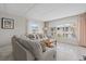 Bright living room featuring neutral colors, comfortable seating, and plenty of natural light at 3806 Gulf Of Mexico Dr # C311, Longboat Key, FL 34228