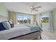 Serene bedroom showcasing water views, a ceiling fan, and cozy furnishings at 3806 Gulf Of Mexico Dr # C311, Longboat Key, FL 34228