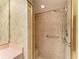 Bathroom boasts tiled walk-in shower with built in seat and safety bars at 410 136Th E Ct, Bradenton, FL 34212