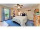 Bedroom with a double bed and a blue carpet at 410 136Th E Ct, Bradenton, FL 34212