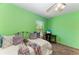 Cozy bedroom with bright green walls at 410 136Th E Ct, Bradenton, FL 34212