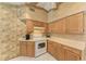 Functional kitchen with ample counter space, oak cabinets, and modern appliances for Gathering cooking at 410 136Th E Ct, Bradenton, FL 34212