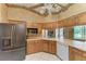 Spacious kitchen boasts modern appliances, generous counter space, and efficient design for cooking convenience at 410 136Th E Ct, Bradenton, FL 34212