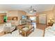 Spacious living room with hardwood floors offering a view of the dining room and front entryway at 410 136Th E Ct, Bradenton, FL 34212