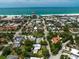 Aerial showcasing a residential area near the beach with views of the city skyline and ocean at 410 Garfield Dr, Sarasota, FL 34236