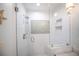 Stylish renovated glass shower with white subway tile and grey accents at 410 Garfield Dr, Sarasota, FL 34236