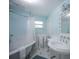 Cozy bathroom featuring a tub with a shower and a pedestal sink at 410 Garfield Dr, Sarasota, FL 34236