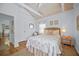 Bright bedroom with a vaulted ceiling, window and comfortable starfish themed bedding at 410 Garfield Dr, Sarasota, FL 34236