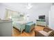 Well-lit bedroom with hardwood floors and stylish coastal themed decor at 410 Garfield Dr, Sarasota, FL 34236