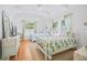 Bright bedroom with vaulted ceiling, two twin beds and sunny windows at 410 Garfield Dr, Sarasota, FL 34236