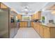 Bright kitchen featuring stainless steel appliances, tile floors, and ample counter space at 410 Garfield Dr, Sarasota, FL 34236