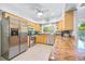 Well-equipped kitchen with stainless steel appliances, granite countertops, and bright natural light at 410 Garfield Dr, Sarasota, FL 34236