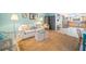 Open concept living space showing kitchen view, decor, and a neutral-toned area rug at 410 Garfield Dr, Sarasota, FL 34236