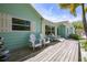 Inviting porch with white Adirondack chairs, perfect for relaxing outdoors at 410 Garfield Dr, Sarasota, FL 34236