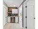 Wet bar featuring a wine fridge, upper shelving and recessed lighting at 4309 Pinfish Ln, Palmetto, FL 34221