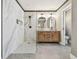 Bathroom featuring walk-in shower, modern vanity with double sinks, and a separate toilet room at 4309 Pinfish Ln, Palmetto, FL 34221