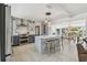 Stylish kitchen featuring a center island with barstool seating, pendant lighting, and stainless steel appliances at 4309 Pinfish Ln, Palmetto, FL 34221