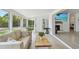 Bright living room with comfortable seating and a view of the outdoor greenery at 4309 Pinfish Ln, Palmetto, FL 34221