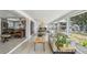 Bright living room with modern furniture, wood floors, and large windows providing plenty of natural light at 4309 Pinfish Ln, Palmetto, FL 34221