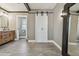 Large main bathroom featuring double barn door and modern vanity with stone floors and accent lighting at 4309 Pinfish Ln, Palmetto, FL 34221