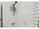 All-white shower featuring a handheld shower head and tiled shower walls at 4309 Pinfish Ln, Palmetto, FL 34221