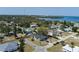 A beautiful aerial view showcases a charming neighborhood and a light blue house with a dark roof at 4403 5Th W Ave, Palmetto, FL 34221