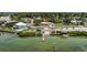 Scenic aerial view showcasing a waterfront community with a boat ramp and dock at 4403 5Th W Ave, Palmetto, FL 34221