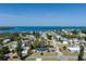 Overhead aerial view features a quaint neighborhood and a light blue house with inviting curb appeal at 4403 5Th W Ave, Palmetto, FL 34221