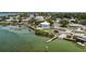 Waterfront homes in a picturesque community are seen in this aerial shot featuring a boat dock at 4403 5Th W Ave, Palmetto, FL 34221