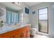 Bathroom with vanity, window, and wood flooring at 4403 5Th W Ave, Palmetto, FL 34221