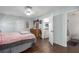 Cozy bedroom featuring soft, neutral colors, hardwood floors, and ample closet space at 4403 5Th W Ave, Palmetto, FL 34221