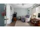 Bedroom featuring a ceiling fan, wood flooring, and neutral paint at 4403 5Th W Ave, Palmetto, FL 34221
