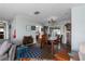 Open-concept dining room featuring hardwood floors and chandelier lighting at 4403 5Th W Ave, Palmetto, FL 34221