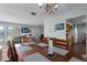 Open dining room with a large dining table, wood chairs, and neutral decor at 4403 5Th W Ave, Palmetto, FL 34221