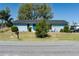 Street view of the home showcasing its lawn and landscaping at 4403 5Th W Ave, Palmetto, FL 34221